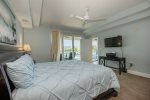 Master bedroom with king bed, flatscreen TV and large ensuite bath